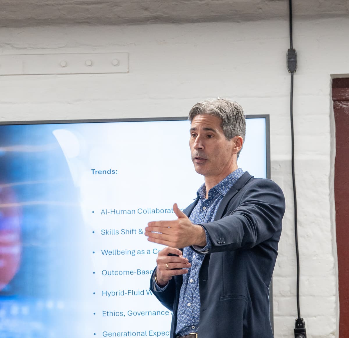 Trent McHugh presenting on leading people through change and AI